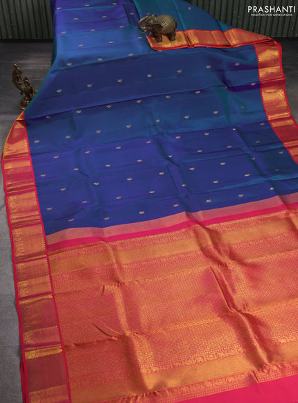 Pure kanchipuram silk saree dual shade of bluish green and dual shade of pinkish orange with paisley zari woven buttas and rich zari woven border