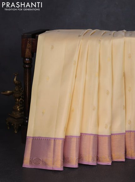 Pure kanchipuram silk saree cream and pastel pink with paisley zari woven buttas and rich zari woven border