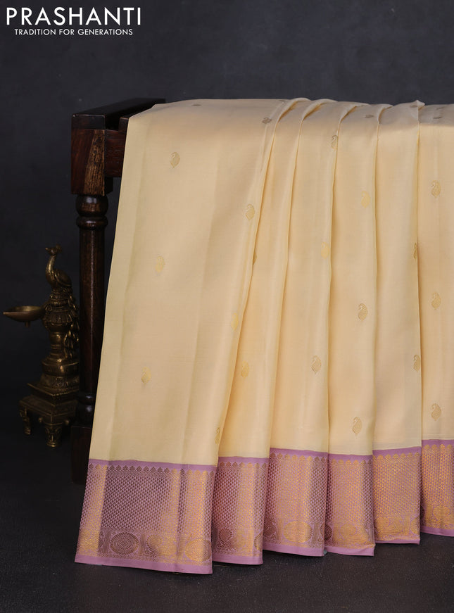 Pure kanchipuram silk saree cream and pastel pink with paisley zari woven buttas and rich zari woven border