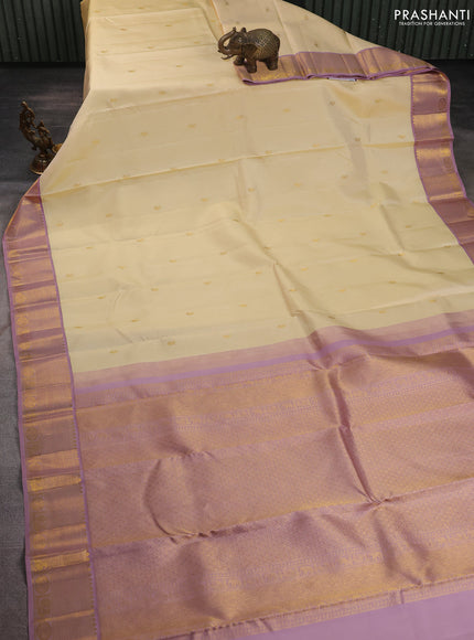 Pure kanchipuram silk saree cream and pastel pink with paisley zari woven buttas and rich zari woven border