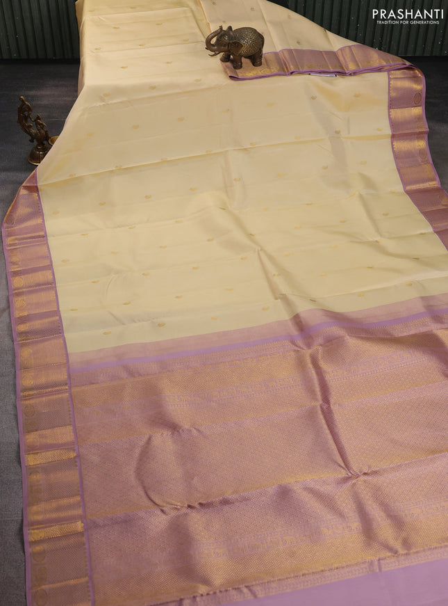 Pure kanchipuram silk saree cream and pastel pink with paisley zari woven buttas and rich zari woven border