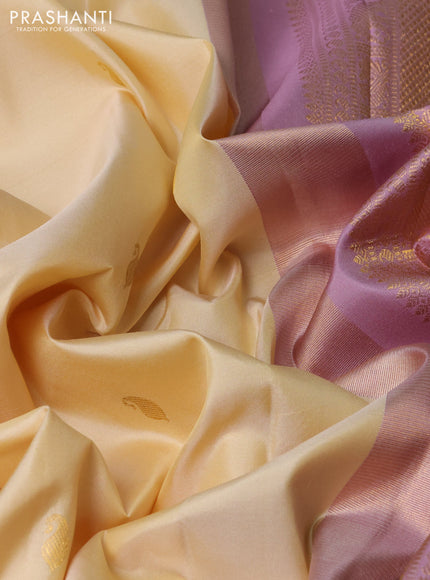 Pure kanchipuram silk saree cream and pastel pink with paisley zari woven buttas and rich zari woven border