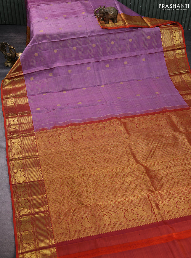 Pure kanchipuram silk saree lavender and rustic orange with allover zari checks & buttas and zari woven border