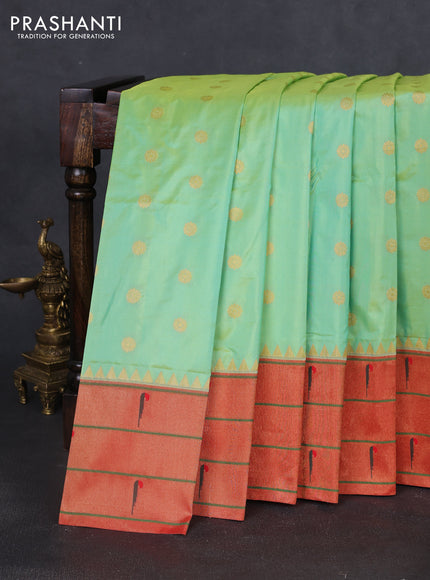 Pure paithani silk saree dual shade of pista green and red with allover zari woven floral buttas and zari woven muniya butta border