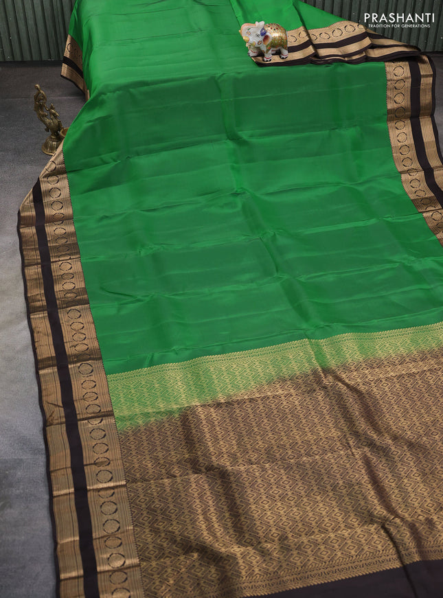 Kanchipuram silk saree green and coffee brown with allover zari woven butas and rettapet zari woven border
