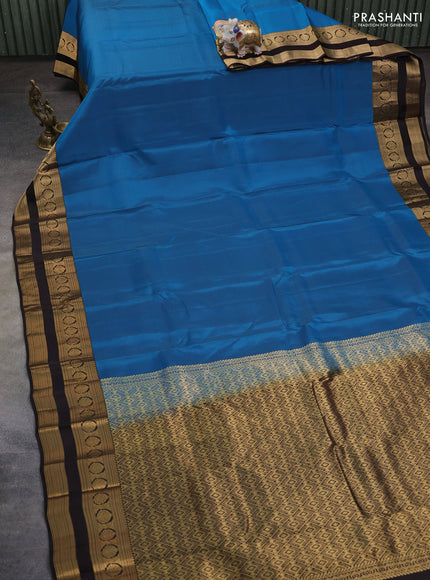 Kanchipuram silk saree peacock blue and coffee brown with plain body and rettapet zari woven border
