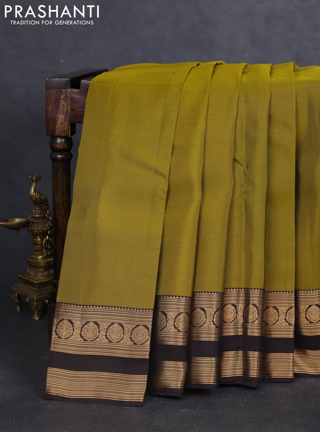 Kanchipuram silk saree mehendi green and coffee brown with plain body and rettapet zari woven border