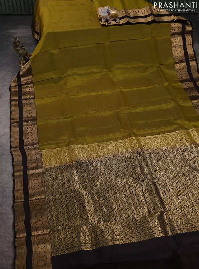 Kanchipuram silk saree mehendi green and coffee brown with plain body and rettapet zari woven border