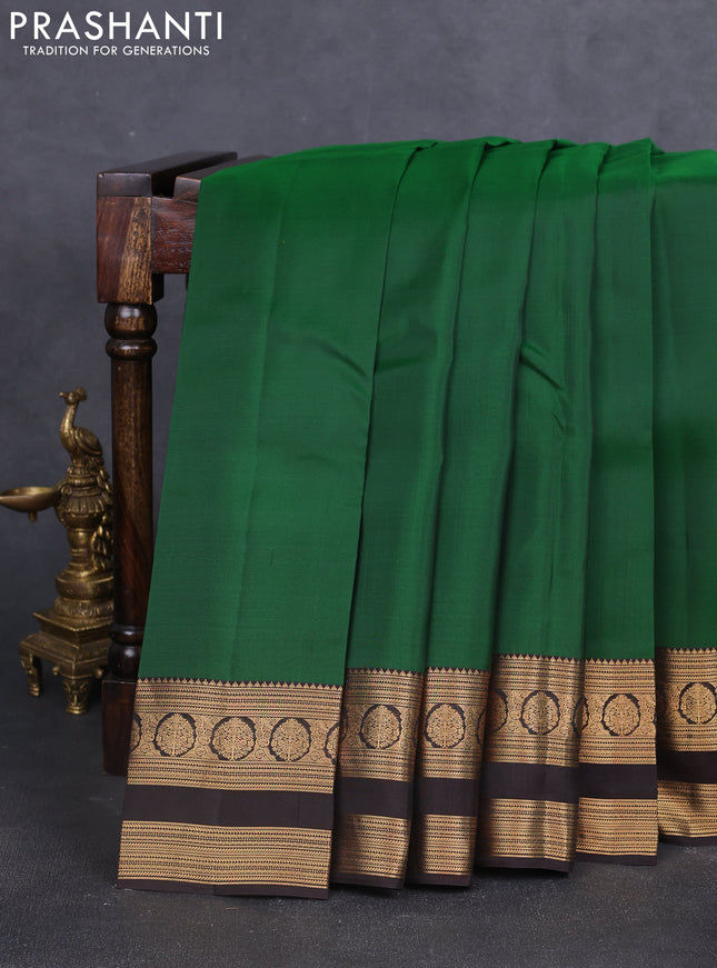 Kanchipuram silk saree green and coffee brown with plain body and rettapet zari woven border