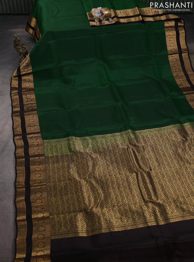 Kanchipuram silk saree green and coffee brown with plain body and rettapet zari woven border