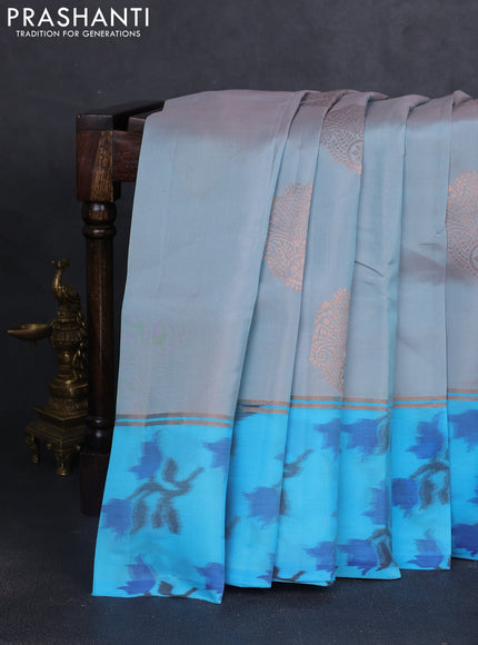 Kanchipuram silk saree greyish blue and cs blue with copper zari woven buttas and copper ikat woven border