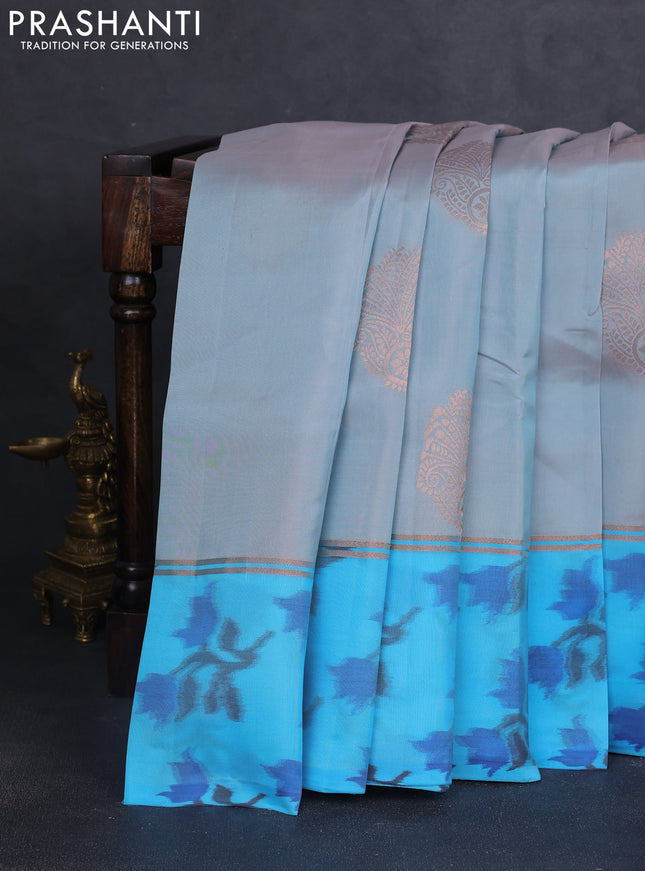 Kanchipuram silk saree greyish blue and cs blue with copper zari woven buttas and copper ikat woven border