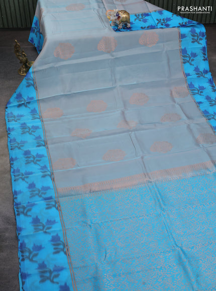 Kanchipuram silk saree greyish blue and cs blue with copper zari woven buttas and copper ikat woven border