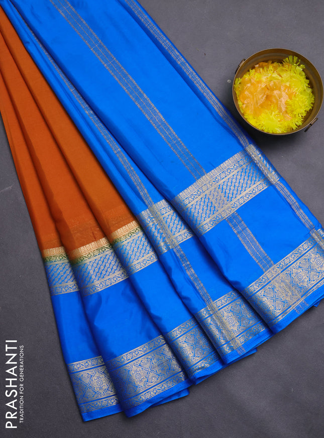 Semi mysore silk saree dark mustard and cs blue with plain body and rettapet zari woven border