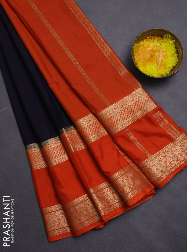 Semi mysore silk saree black and rust shade with plain body and rettapet zari woven border