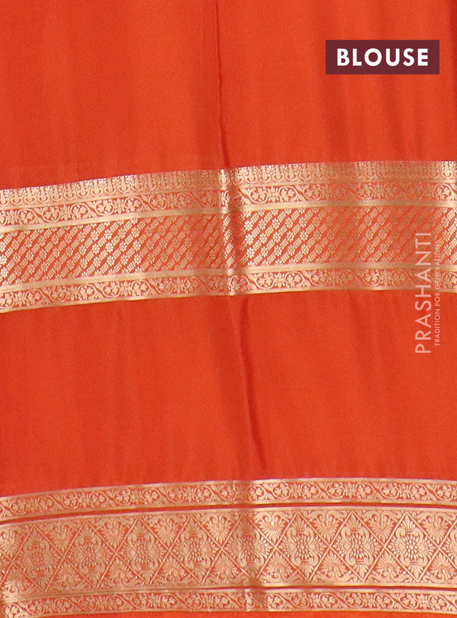 Semi mysore silk saree black and rust shade with plain body and rettapet zari woven border