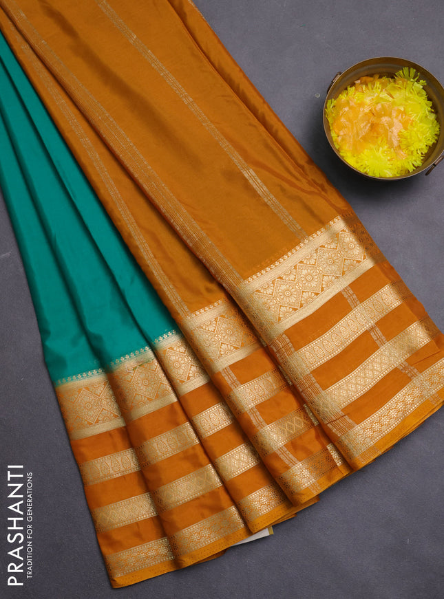 Semi mysore silk saree green and mustard yellow with plain body and long zari woven border