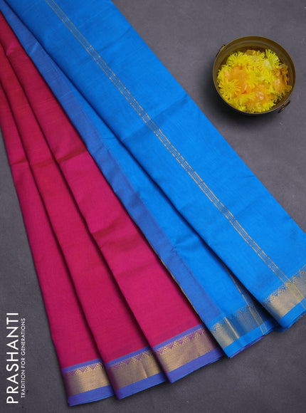 Silk cotton saree pink and cs blue with plain body and zari woven border