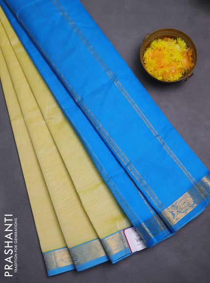 Silk cotton saree pale yellow and cs blue with plain body and zari woven border