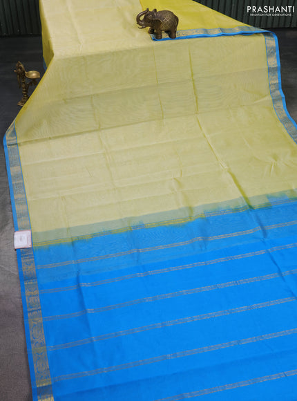 Silk cotton saree pale yellow and cs blue with plain body and zari woven border
