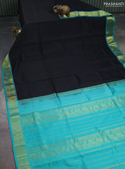 Silk cotton saree black and teal green with plain body and zari woven border