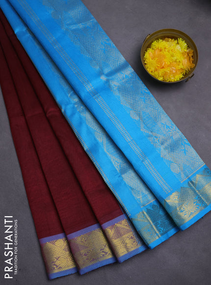 Silk cotton saree maroon and cs blue with plain body and zari woven border