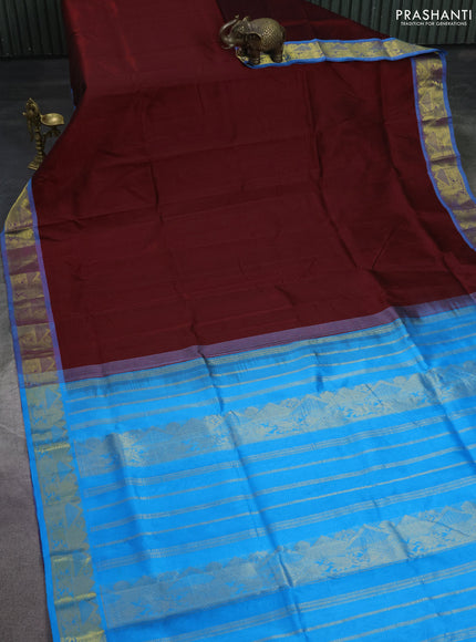 Silk cotton saree maroon and cs blue with plain body and zari woven border