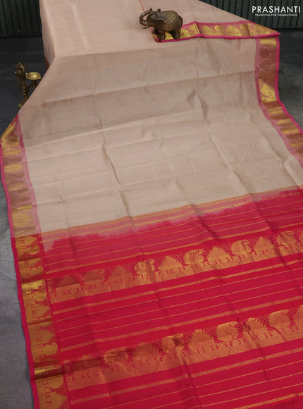 Silk cotton saree beige and pink with plain body and temple & paisley zari woven butta border