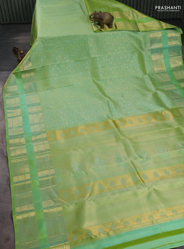 Pure kanchipuram silk saree dual shade of light green with allover zari woven brocade weaves and long rettapet zari woven border