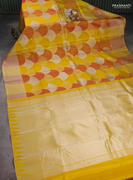 Pure kanchipuram silk saree yellow and dark mustard with allover zari woven geometric brocade weaves and silver zari woven border