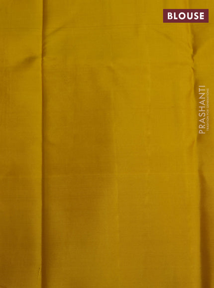 Pure kanchipuram silk saree yellow and dark mustard with allover zari woven geometric brocade weaves and silver zari woven border
