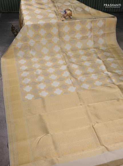 Pure kanchipuram silk saree beige with allover zari weaves and rich zari woven border