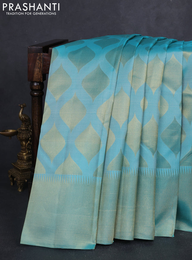 Pure kanchipuram silk saree teal blue with allover zari woven geometric butta weaves and temple design zari woven border