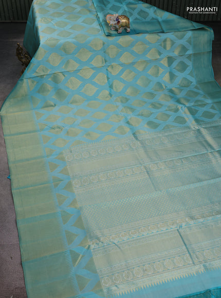 Pure kanchipuram silk saree teal blue with allover zari woven geometric butta weaves and temple design zari woven border