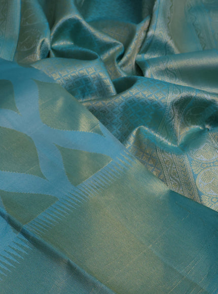 Pure kanchipuram silk saree teal blue with allover zari woven geometric butta weaves and temple design zari woven border