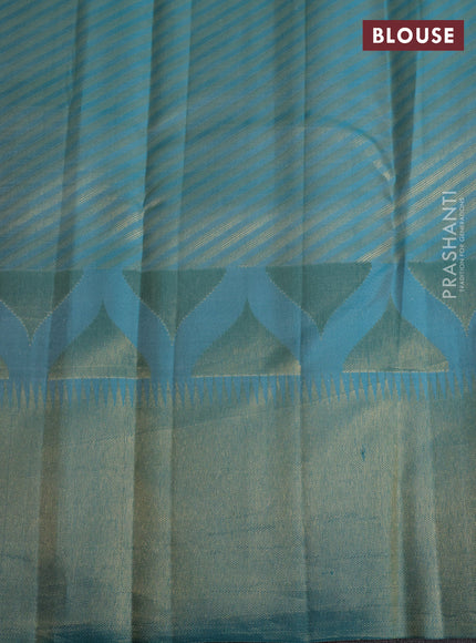 Pure kanchipuram silk saree teal blue with allover zari woven geometric butta weaves and temple design zari woven border