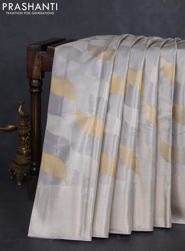 Pure kanchipuram tissue silk saree pastel grey with allover silver & gold zari woven brocade weaves and silver zari woven border