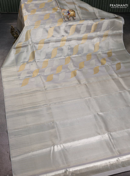Pure kanchipuram tissue silk saree pastel grey with allover silver & gold zari woven brocade weaves and silver zari woven border