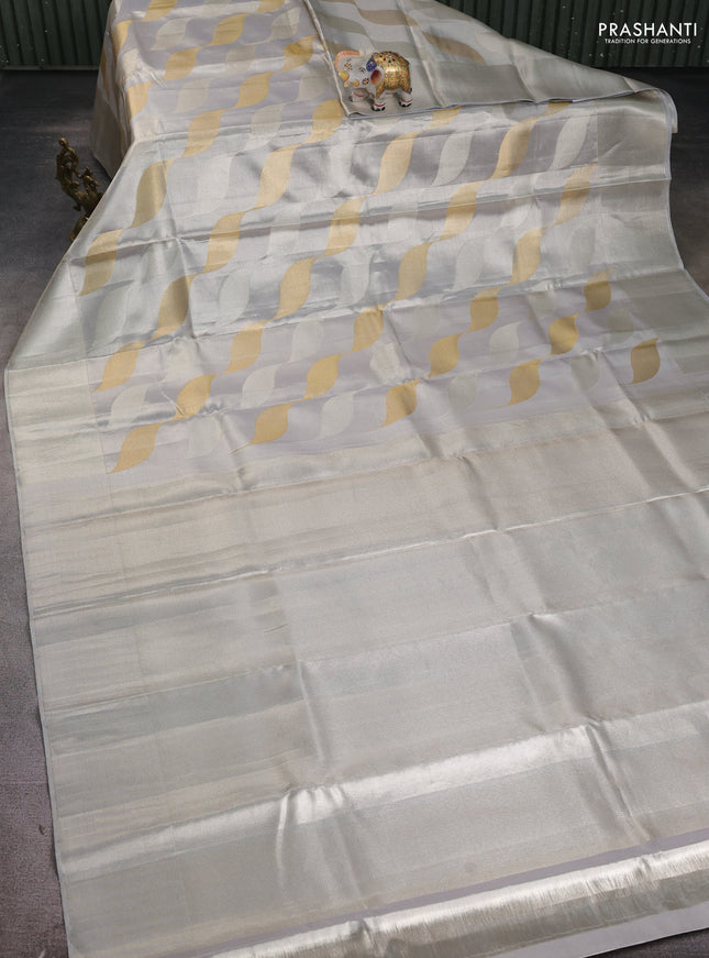 Pure kanchipuram tissue silk saree pastel grey with allover silver & gold zari woven brocade weaves and silver zari woven border