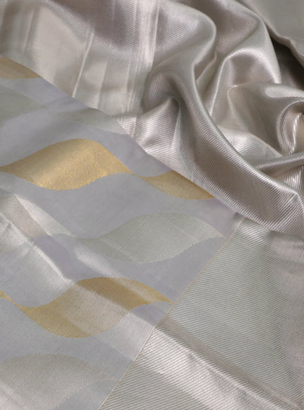 Pure kanchipuram tissue silk saree pastel grey with allover silver & gold zari woven brocade weaves and silver zari woven border