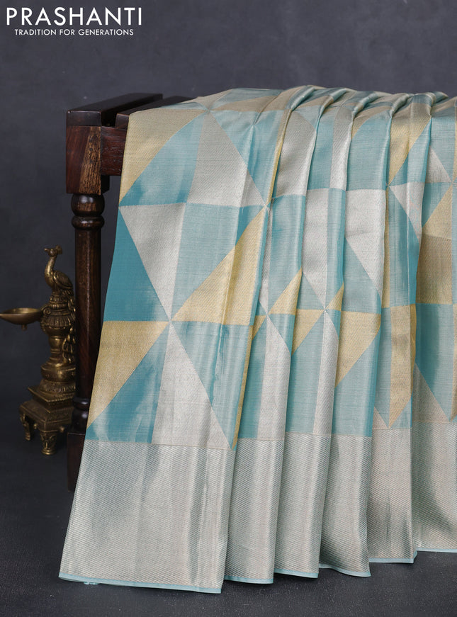 Pure kanchipuram tissue silk saree teal blue with allover zari woven geometric brocade weaves and silver zari woven border