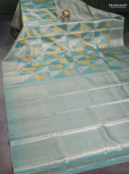 Pure kanchipuram tissue silk saree teal blue with allover zari woven geometric brocade weaves and silver zari woven border