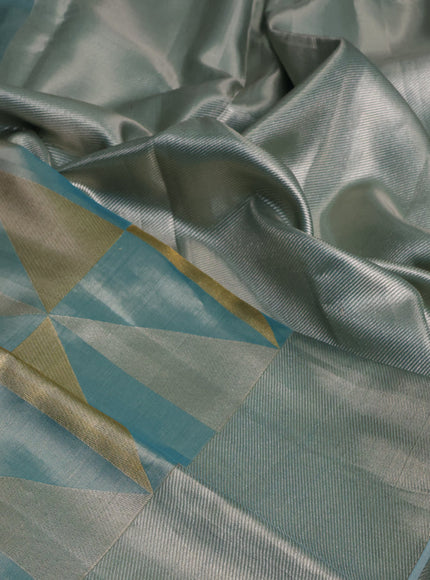 Pure kanchipuram tissue silk saree teal blue with allover zari woven geometric brocade weaves and silver zari woven border