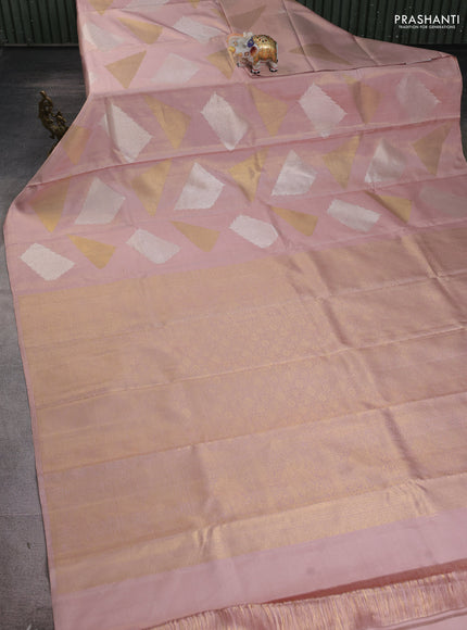 Pure kanchipuram silk saree pastel peach with allover zari woven geometric brocade weaves in borderless style
