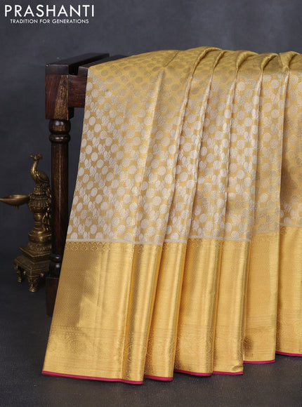 Pure kanchipuram tissue silk saree gold and dark pink with allover zari woven brocade weaves and long zari woven border