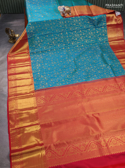 Pure kanchipuram silk saree dual shade of teal bluish green and red with allover zari woven brocade weaves and zari woven border