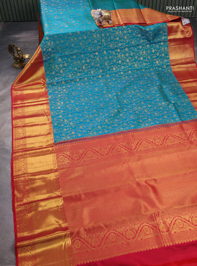 Pure kanchipuram silk saree dual shade of teal bluish green and red with allover zari woven brocade weaves and zari woven border