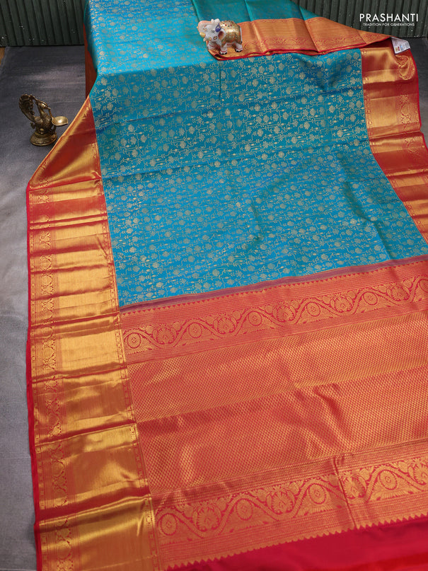 Pure kanchipuram silk saree dual shade of teal bluish green and red with allover zari woven brocade weaves and zari woven border
