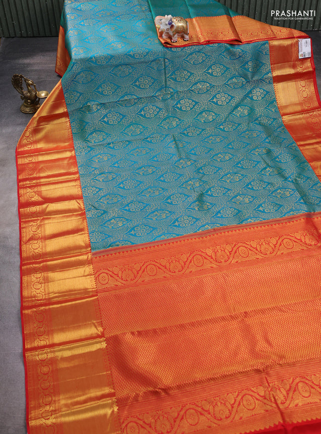 Pure kanchipuram silk saree dual shade of teal bluish green and red with allover zari woven brocade weaves and zari woven border