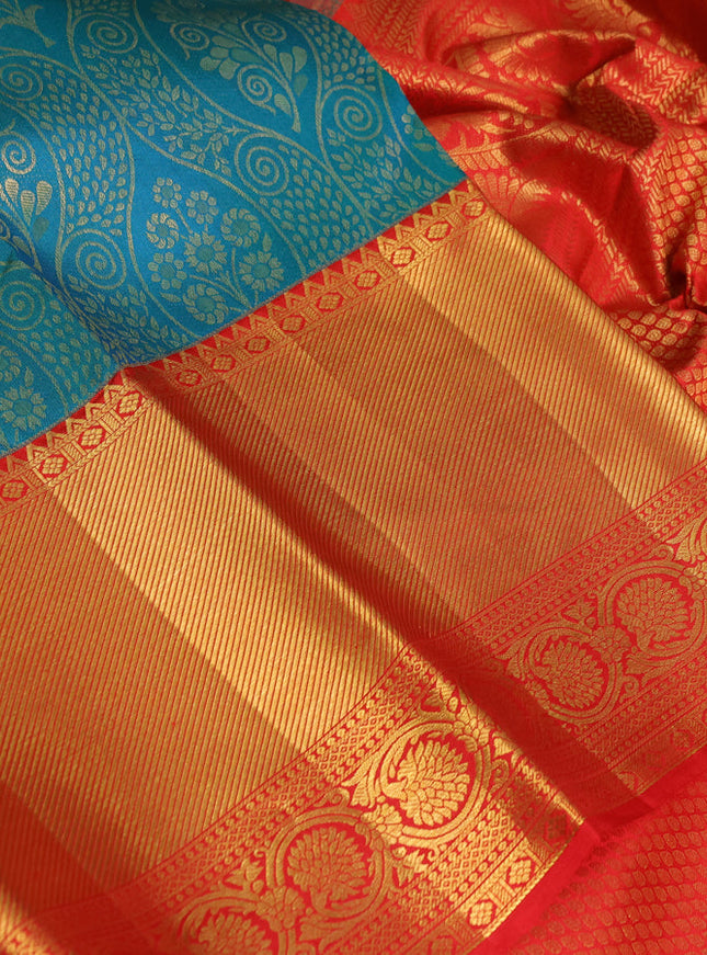 Pure kanchipuram silk saree dual shade of teal bluish green and red with allover zari woven brocade weaves and zari woven border